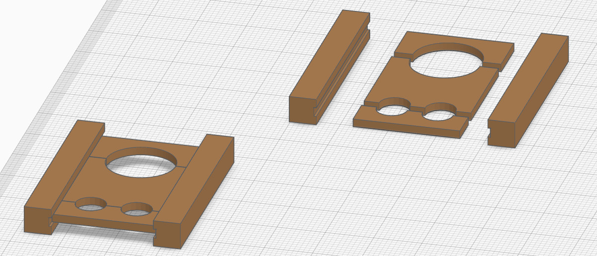 Schéma exporté de tinkercad représentant deux modéles du carcan en 3D. Sur un modèle, les parties sont séparées. Sur l'autre, l'objet est monté.
